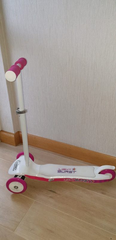 light burst pink and white scooter